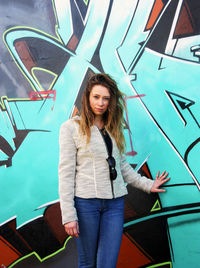 Portrait of young woman standing outdoors