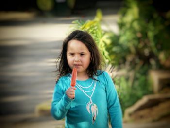 Portrait of girl standing outdoors