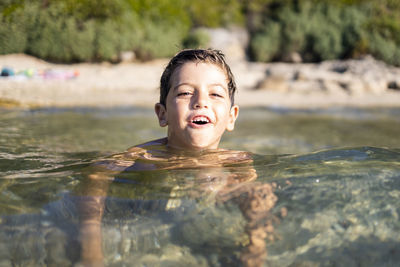 Portrait of boy in swimming pool