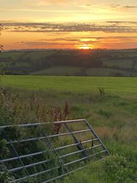 Scenic view of landscape against sky during sunset