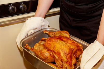 Midsection of man preparing food