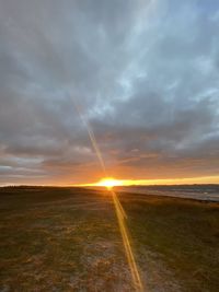 Scenic view of landscape against sky during sunset