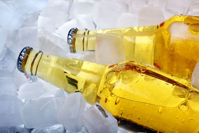 Close-up of yellow bottle against white background