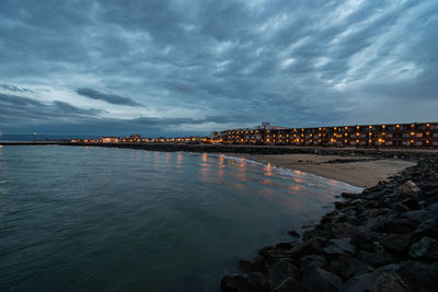 High angle view of sea against sky at sunset