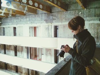 Woman photographing through smart phone