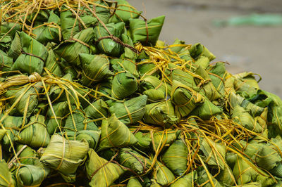 Naem or cured meats wrapped in leaves which is a traditional khmer food