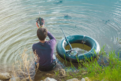 Rear view of woman in lake