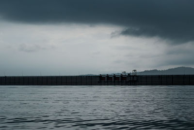 Pier over sea against sky