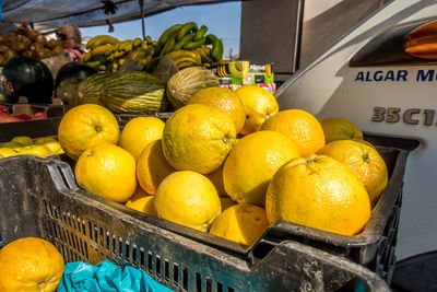 Fruits in basket for sale at market stall