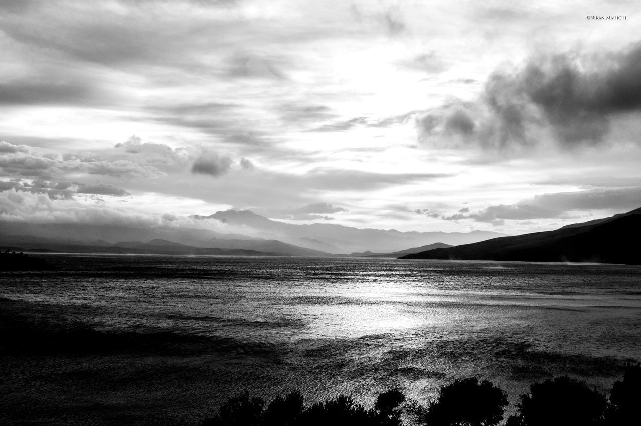 water, tranquil scene, sky, sea, scenics, tranquility, beauty in nature, beach, cloud - sky, mountain, shore, nature, cloudy, cloud, coastline, idyllic, silhouette, horizon over water, non-urban scene, outdoors