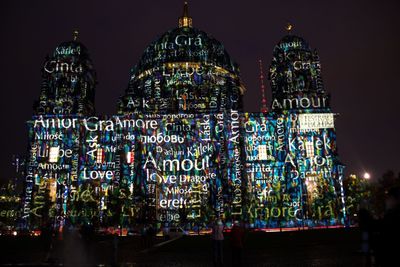 Exterior of berlin cathedral during festival of lights at night