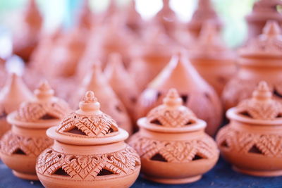 Close-up of designed pots at market stall