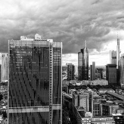 City skyline against cloudy sky