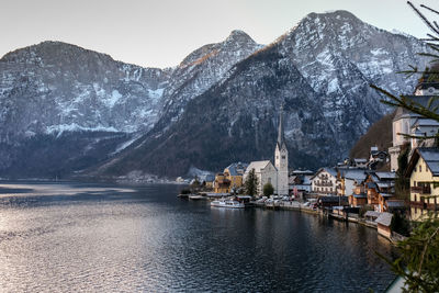 Scenic view of lake of hallstatt by mountain during winter
