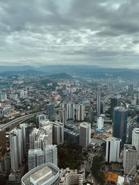 High angle view of modern buildings in city against sky