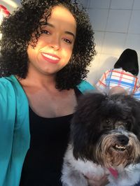 Portrait of young woman with dog