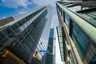 Low angle view of modern buildings against sky