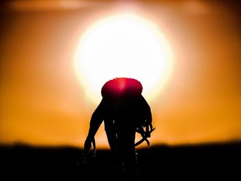 Silhouette of woman at sunset