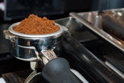 Close-up of ground coffee in container