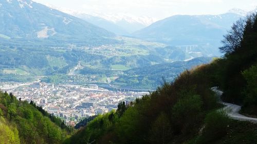 High angle view of townscape and mountains