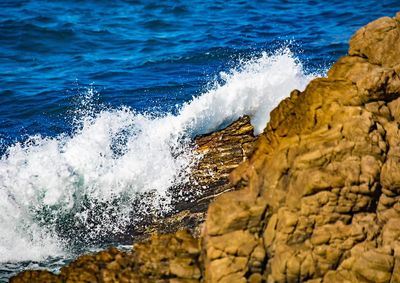 Sea waves splashing on rocks