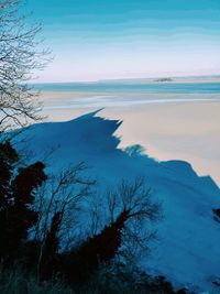 Scenic view of sea against sky during winter