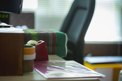 Close-up of open book on table at home