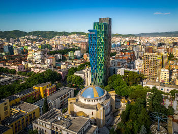 High angle view of buildings in city against sky