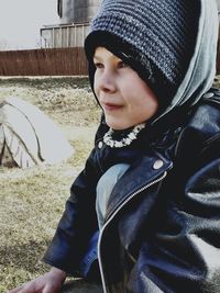 Close-up portrait of boy in park during winter