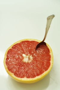 Close-up of fruit against white background