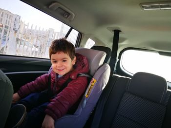 Portrait of boy sitting in car