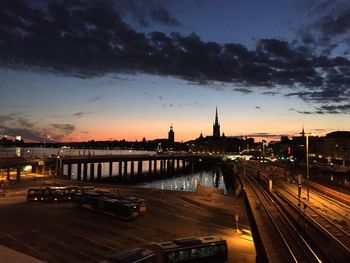 View of illuminated city at sunset