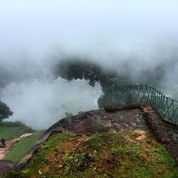 Scenic view of mountain against cloudy sky