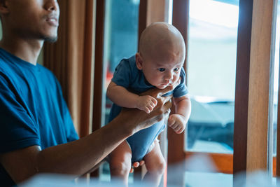 Side view of man using mobile phone