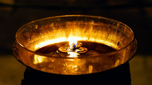 Close-up of illuminated diya