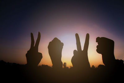 Silhouette of hands gesture v sign and fist power for victory/peace. success and winner in 2020.