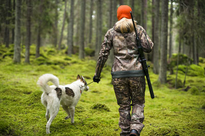 View of a dog standing in forest