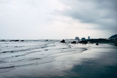 Scenic view of beach against sky