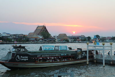 View of illuminated city against sky during sunset