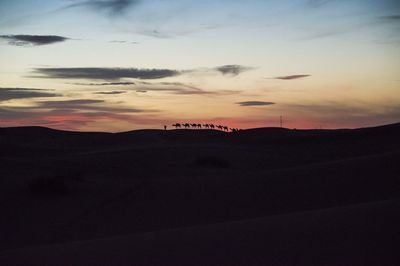 Scenic view of silhouette landscape against sky during sunset