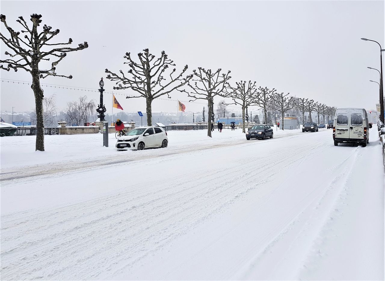 VIEW OF SNOW COVERED STREET IN WINTER