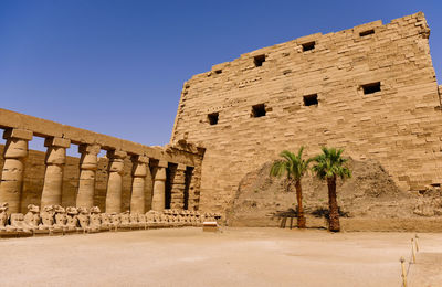 Low angle view of old building against clear sky