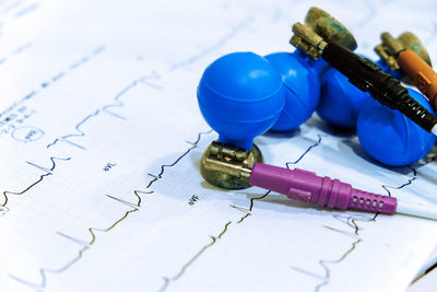 High angle view of equipment on paper