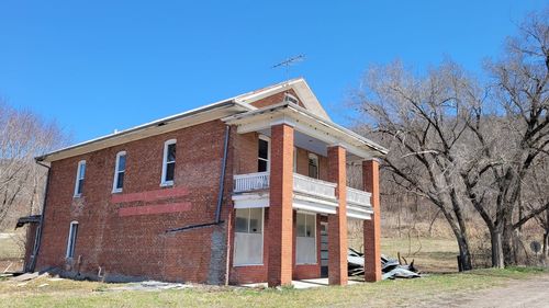 Low angle view of building against clear blue sky