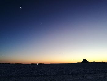 Scenic view of sea against sky at sunset