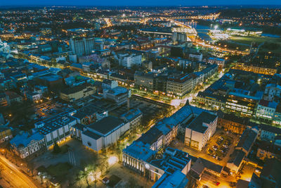 Aerial view of illuminated city at night