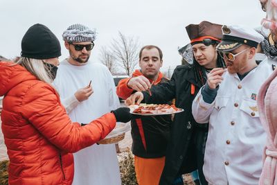 Group of people standing in snow