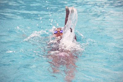 High angle view of man swimming in sea