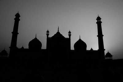 Silhouette of traditional against clear sky during sunset