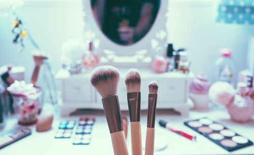 Close-up of paintbrushes on table